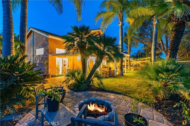 view of patio / terrace with an outdoor fire pit