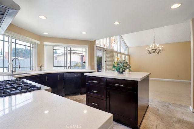 kitchen featuring recessed lighting, lofted ceiling, and a sink