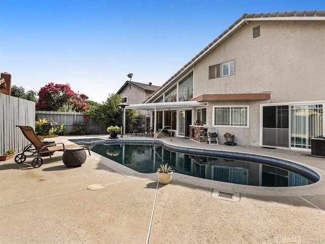 view of pool with a fenced in pool, a fenced backyard, a pergola, and a patio area