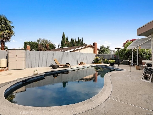 view of pool with a patio area, a fenced in pool, and a fenced backyard