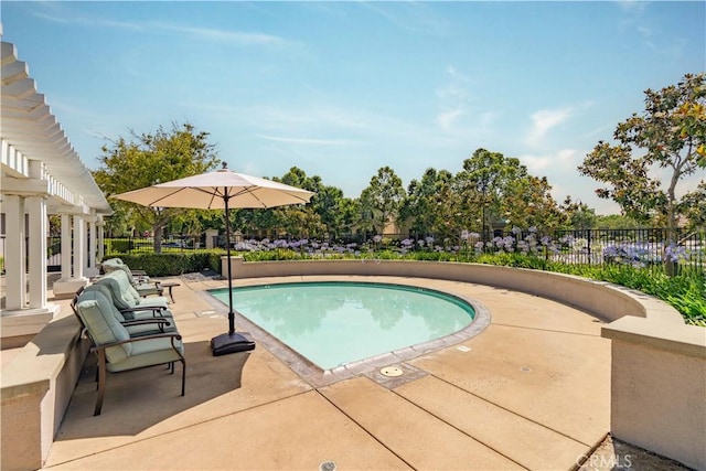 view of pool with a patio area, a fenced in pool, a pergola, and fence