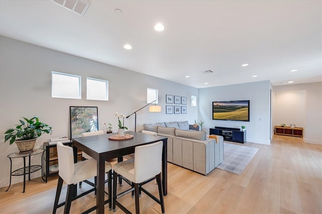 dining space featuring recessed lighting, light wood-style floors, and visible vents