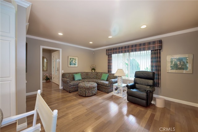 living area with recessed lighting, ornamental molding, baseboards, and wood finished floors