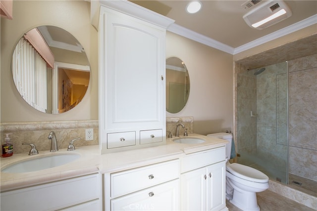 full bath featuring ornamental molding, toilet, and a sink