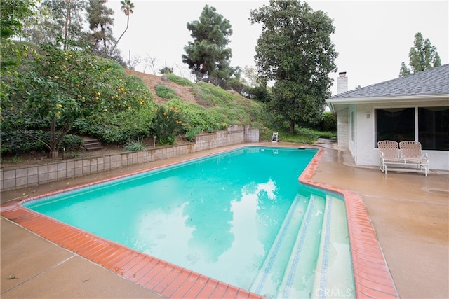 view of pool with a fenced in pool and a patio