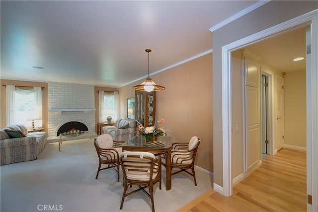 dining space with baseboards, plenty of natural light, and ornamental molding