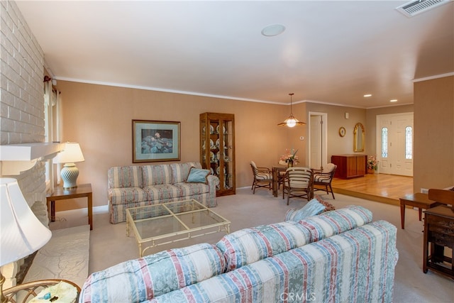 carpeted living room with crown molding, baseboards, and visible vents