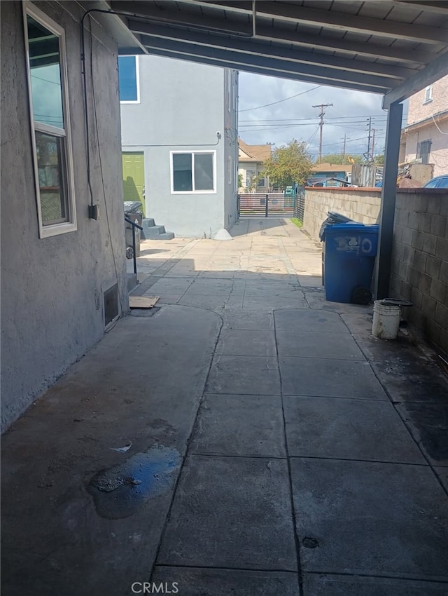 view of patio featuring fence