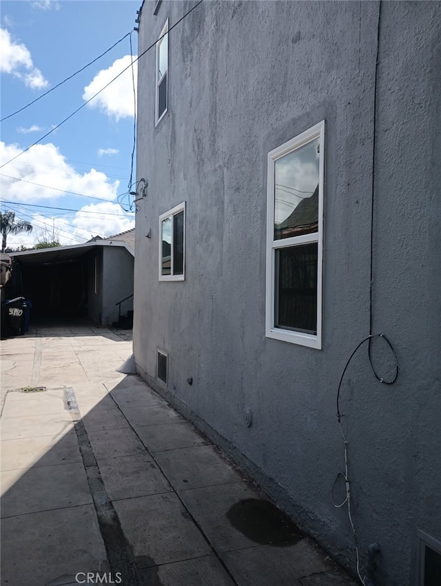 view of property exterior featuring a patio area and stucco siding