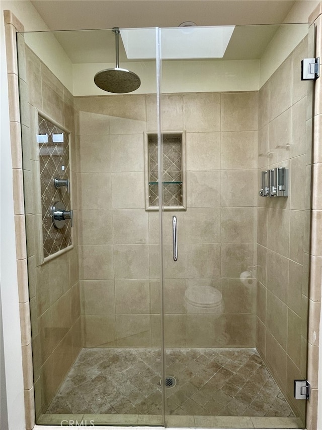 full bathroom featuring a stall shower