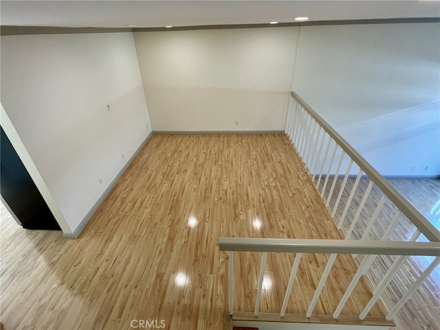 interior space featuring wood finished floors and baseboards