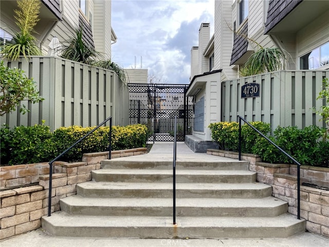 view of exterior entry with fence