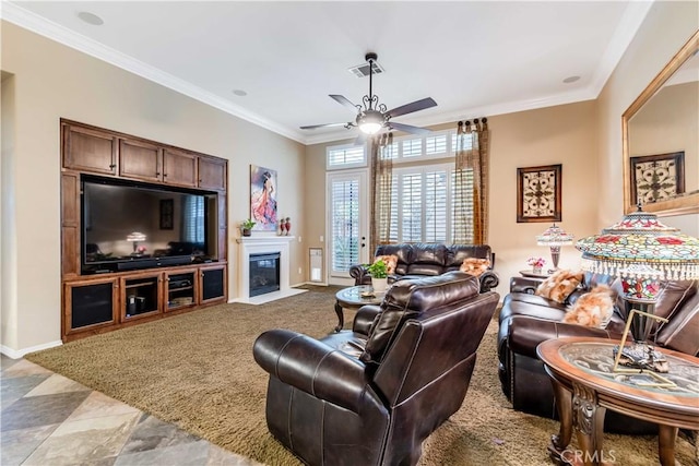 living area featuring ceiling fan, visible vents, and ornamental molding