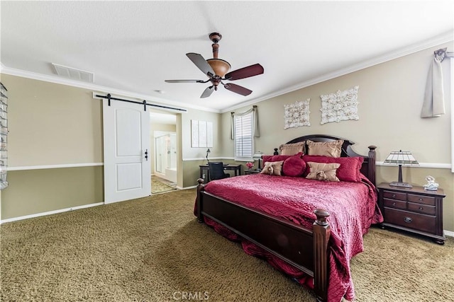 bedroom featuring a barn door, carpet, visible vents, and ornamental molding