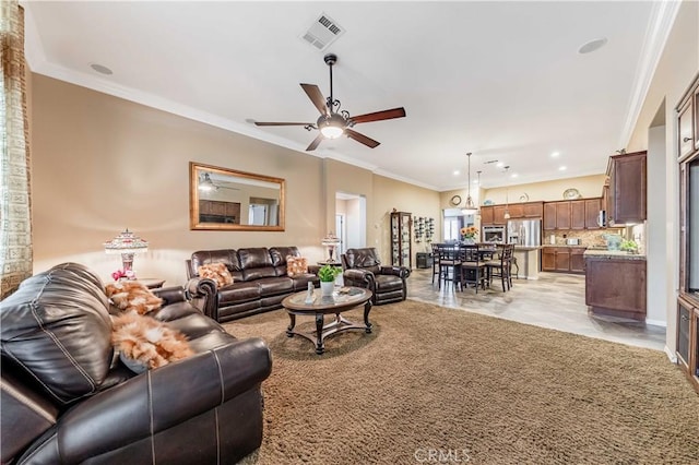 living area featuring crown molding, recessed lighting, a ceiling fan, and visible vents