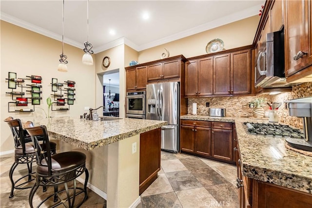 kitchen with a sink, light stone counters, tasteful backsplash, and stainless steel appliances