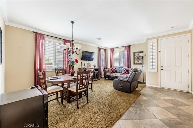 dining room featuring visible vents, baseboards, crown molding, and an inviting chandelier