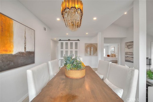 dining space featuring recessed lighting, visible vents, baseboards, and an inviting chandelier