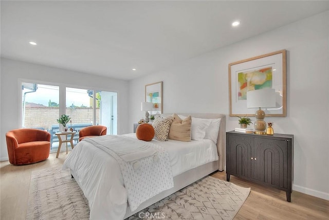 bedroom featuring recessed lighting, light wood-style flooring, and baseboards