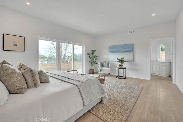 bedroom featuring recessed lighting, wood finished floors, and visible vents