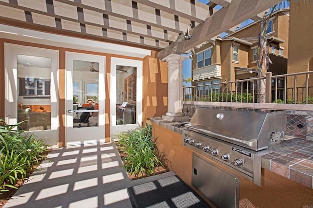 view of patio / terrace with exterior kitchen and french doors