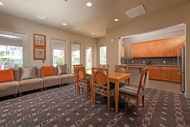 dining room with tile patterned flooring, recessed lighting, and visible vents