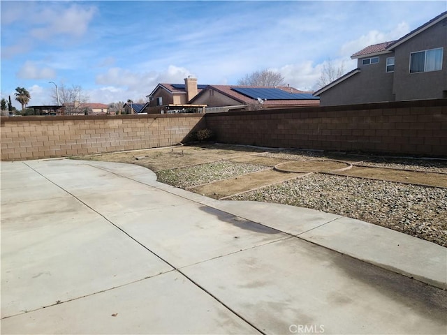 view of yard with a patio area and a fenced backyard