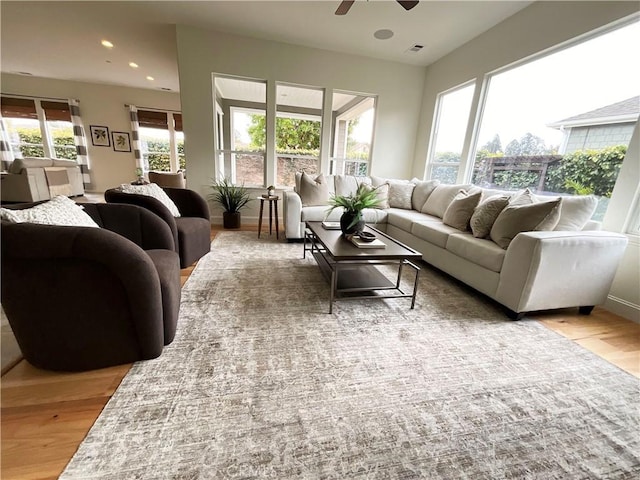 living room with recessed lighting, wood finished floors, visible vents, and ceiling fan