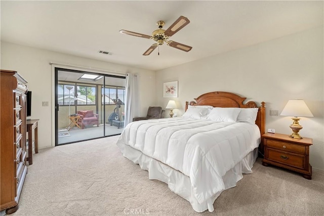 carpeted bedroom with ceiling fan, visible vents, and access to exterior