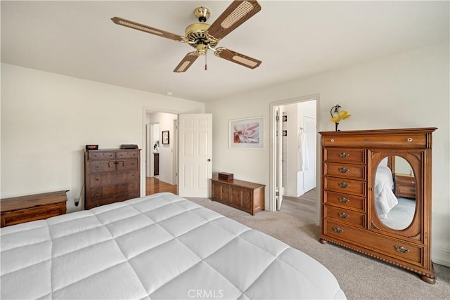 bedroom featuring a ceiling fan and carpet