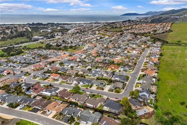 bird's eye view with a residential view and a water and mountain view