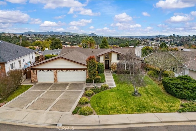 ranch-style home featuring an attached garage, a residential view, concrete driveway, a front lawn, and a mountain view