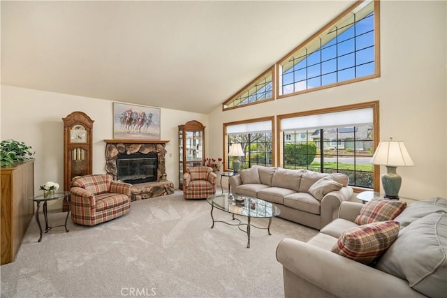 carpeted living area with high vaulted ceiling and a fireplace