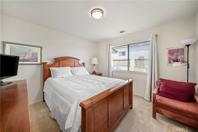 bedroom featuring light carpet, visible vents, and baseboards