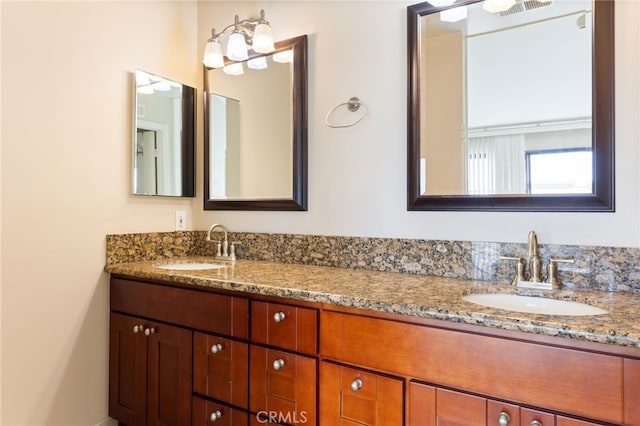 bathroom with double vanity and a sink