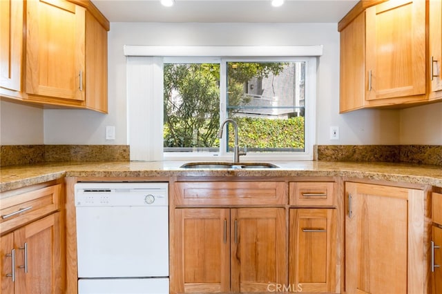 kitchen with recessed lighting, dishwasher, and a sink