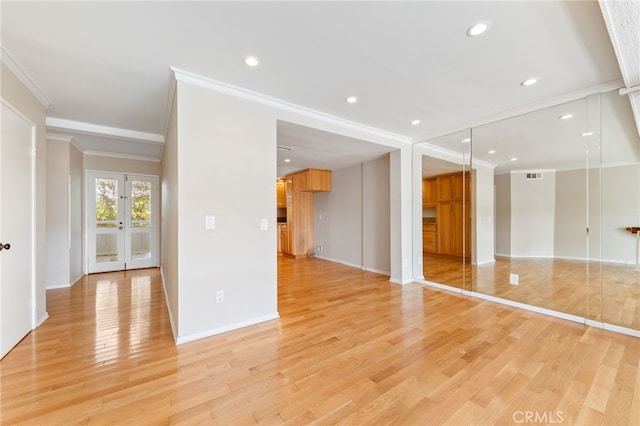 interior space featuring recessed lighting, visible vents, ornamental molding, and light wood finished floors