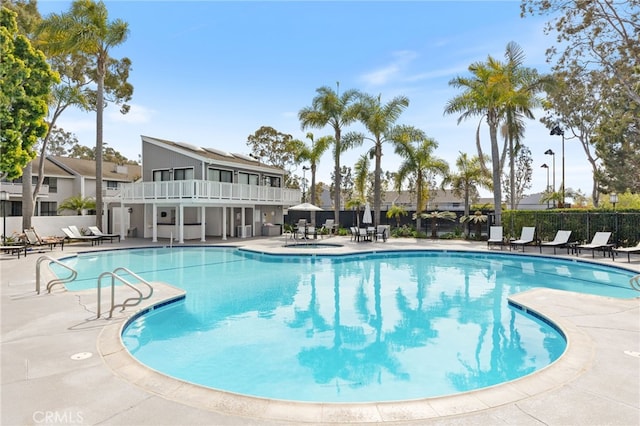 pool featuring a patio and fence