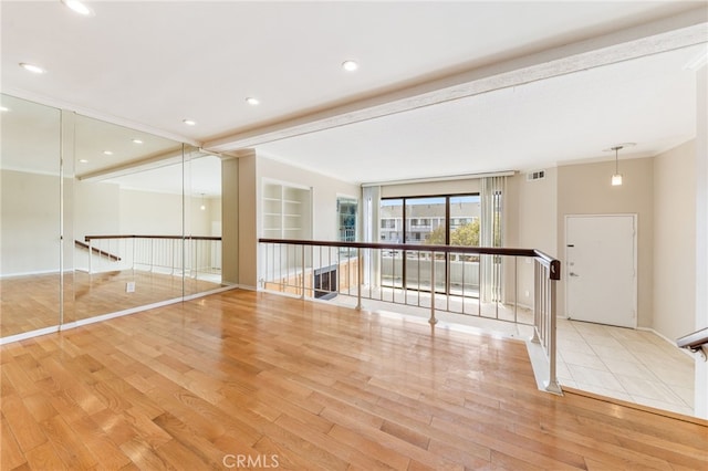 spare room featuring recessed lighting, visible vents, and wood finished floors