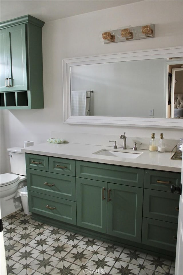 bathroom with vanity, tile patterned floors, and toilet