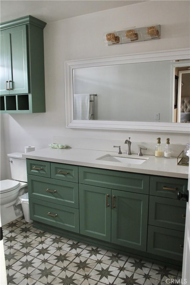 bathroom featuring tile patterned floors, toilet, and vanity