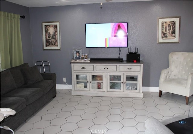 living room featuring baseboards