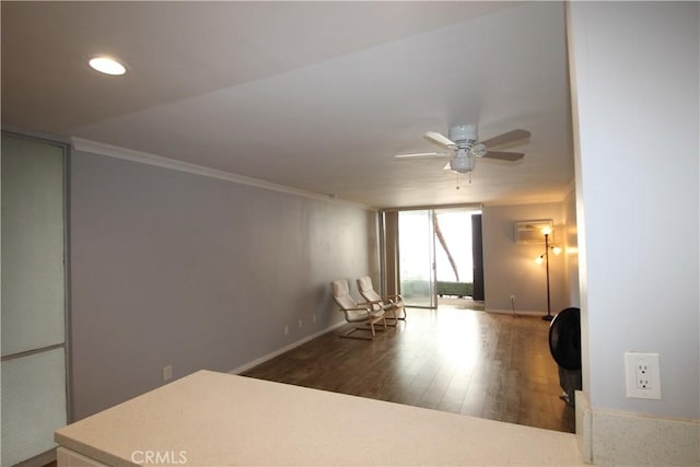 unfurnished room with wood finished floors, baseboards, ceiling fan, floor to ceiling windows, and crown molding