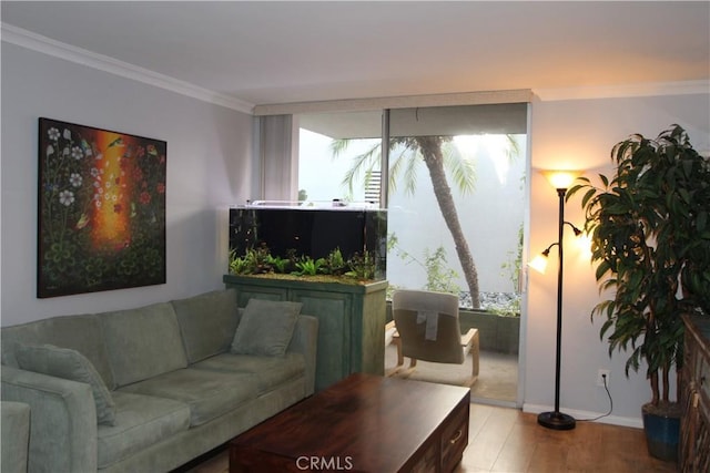 living area with wood finished floors and crown molding