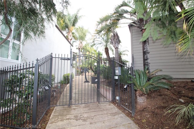 view of gate with fence