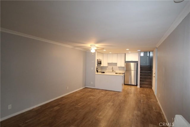 4545 Collwood Blvd Unit 19, San Diego, CA 92115 - unfurnished living room featuring crown molding, ceiling fan, dark wood-type flooring, stairway, and recessed lighting