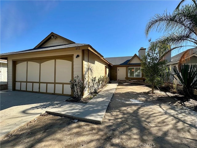 view of front of house with a garage and driveway