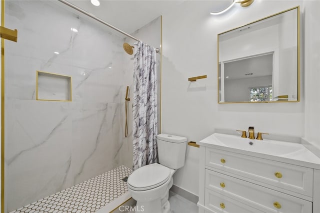 full bath with vanity, toilet, baseboards, and a marble finish shower