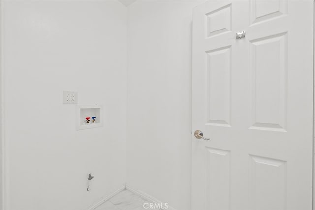 clothes washing area with laundry area, hookup for a washing machine, marble finish floor, and baseboards