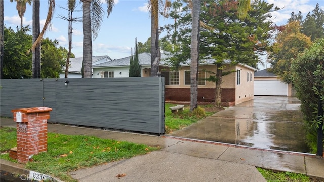 exterior space with an outbuilding and fence